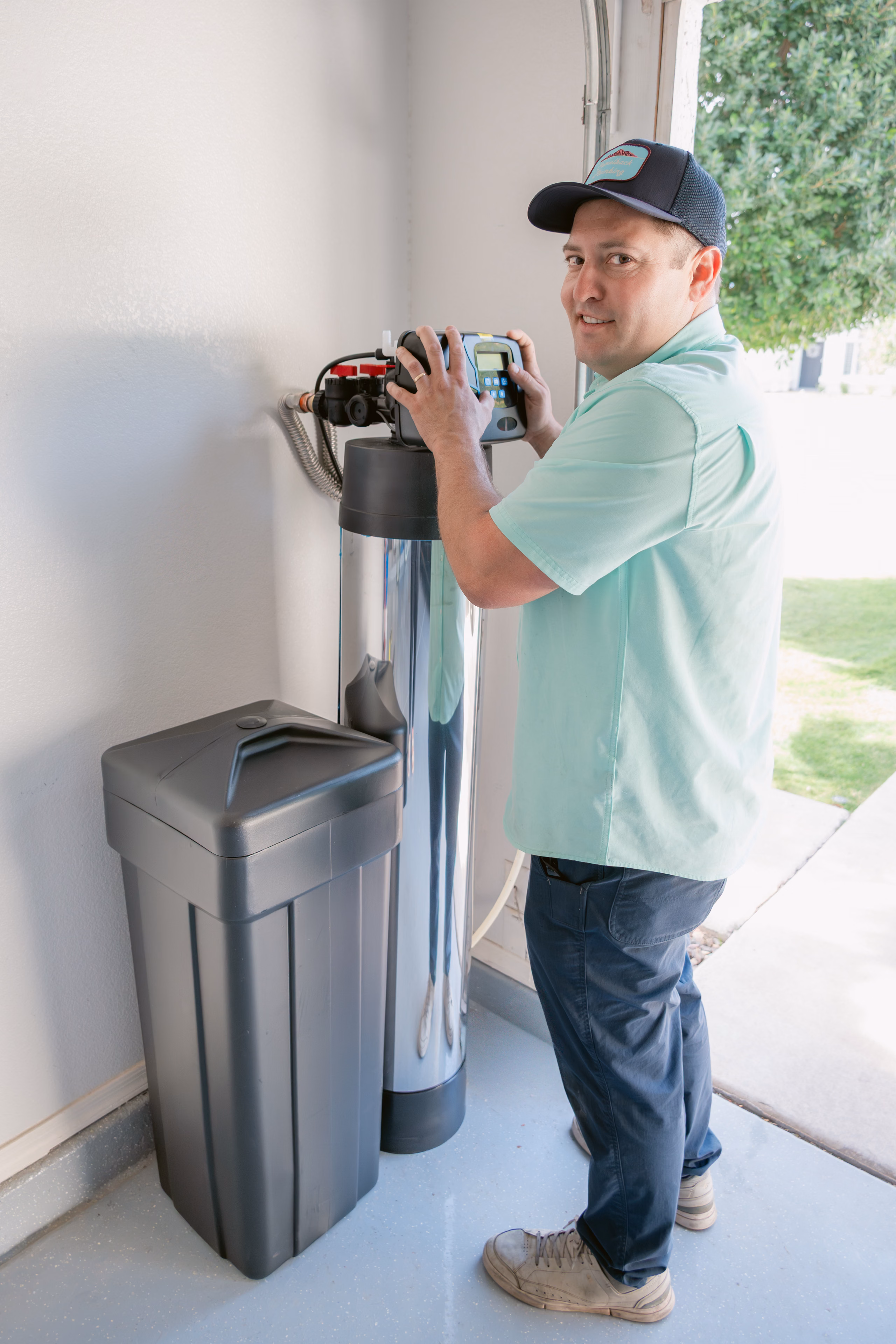Gabe Sandersius servicing a home water-treatment system