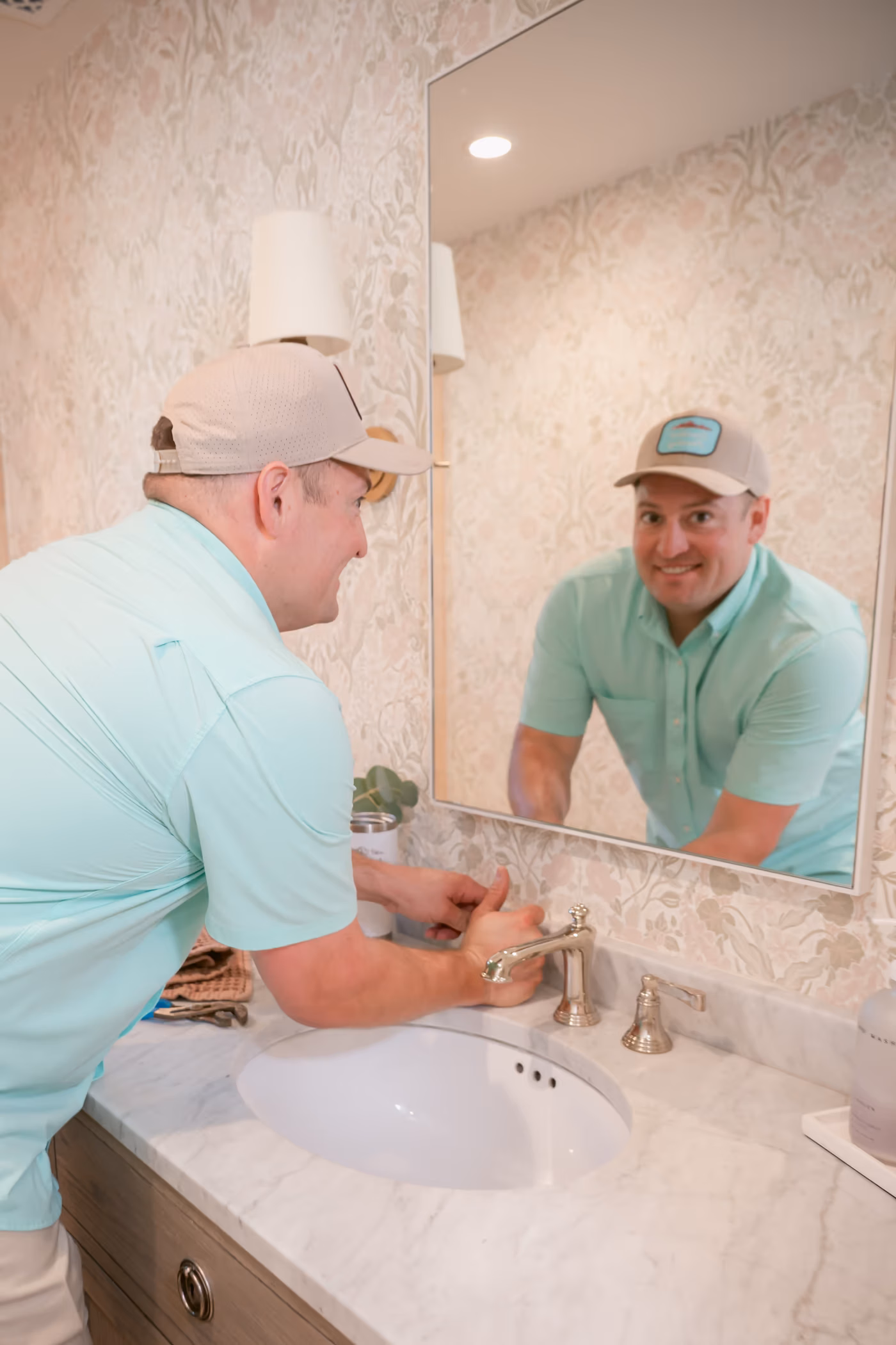 Gabe Sandersius talking through a plumbing service visit with a Phoenix homeowner